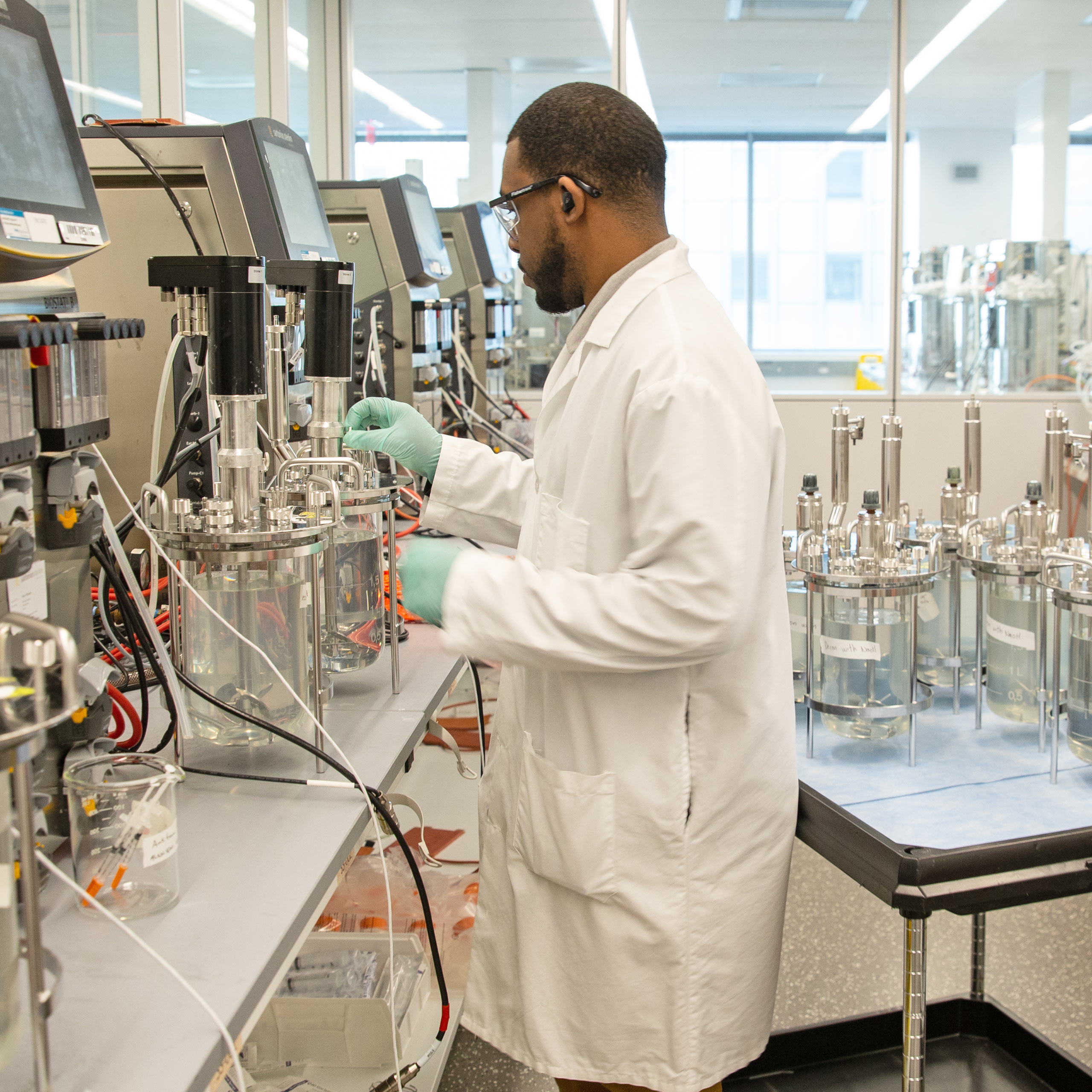 An Alexion employee working in a lab